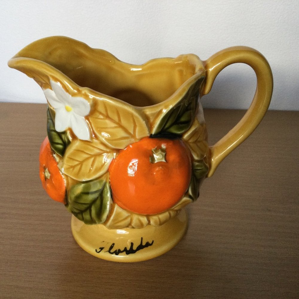 Ceramic majolica style jar pitcher small with raised oranges signed small